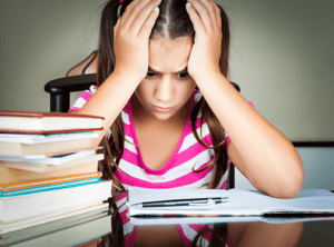 Girl struggling with homework.